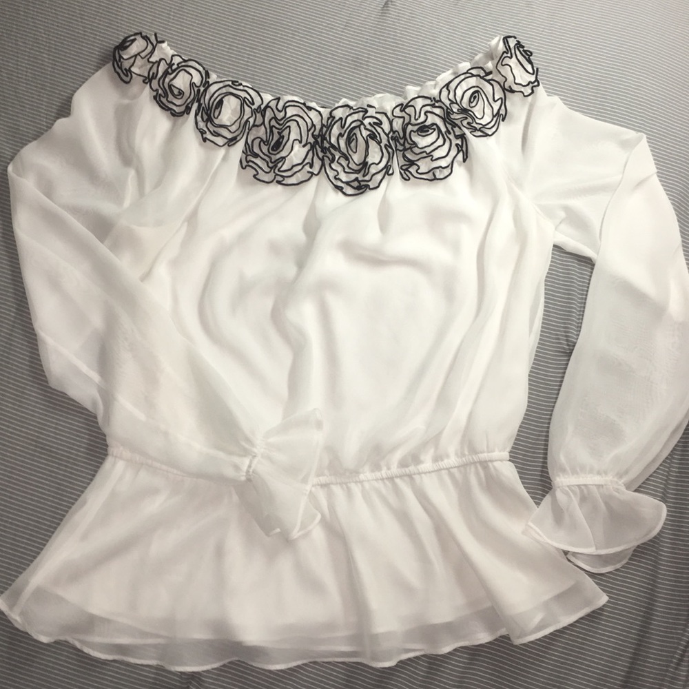White and black flowy blouse